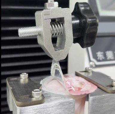 Mesin Uji Pengelupasan Universal Untuk Jelly Packaging Cover Film Tearing Strength Beban Maksimum 2KN